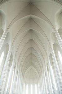 white building with light coming in through long tall windows Swedish church