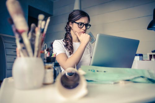 woman doing a search on the computer at a desk