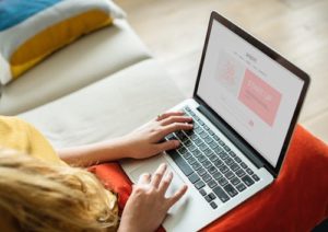 woman searching danish websites on computer