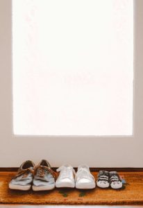 shoes lined up in front of door