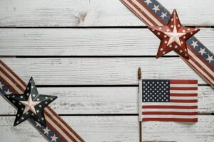 4 easy steps to join a lineage society, www.savvygenealogy.com, American flag decorations on wood background