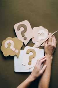 how to know when you need to hire a genealogist, www.savvygenealogy.com, question marks on dark background